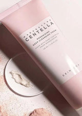 Pink skincare product with 'Madagascan Centella' label on a light background
