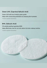 Two round white makeup remover pads with a textured cross-hatch pattern, displayed on a light blue background with descriptive text about Green LHA and BHA ingredients.