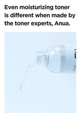 Anua toner bottle with text about being made by experts on a light blue background