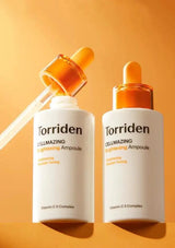 Two Torriden CellMazing Lightening Ampoules with droppers on an orange background