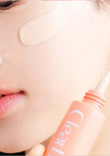 Close-up of a person applying a pink lip balm labeled 'Glow' to their lips.