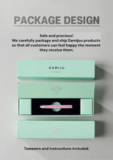 Mint green packaging with Damiju logo on a gray background