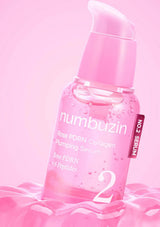 Pink serum bottle with 'numbuzin' branding on a pink background