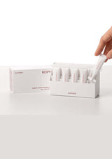 KOPHER product packaging with a hand holding a white tube on a white background