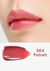 Close-up of pink lipstick on lips with a swatch labeled '564 Potrait' below.