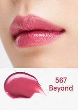 Close-up of pink lipstick on lips with a swatch labeled '567 Beyond' below.
