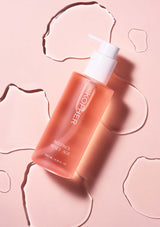 KOPHER serum bottle on a pink background