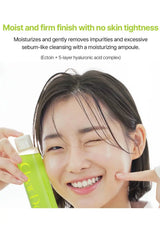 ClearDea Minari Pore Ampoule Cleanser held beside a smiling model, highlighting moisturising cleansing without skin tightness