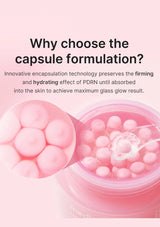 Pink container with pearl-like beads and a spoon on a white background