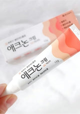 Two tubes of 'Aekyung' cream on a white background