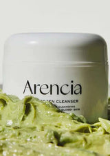 Jar of green facial cleanser with 'Arencia' branding on a white background