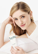 Tube of Purita Seoul oil-in-calming gel cream on a soft fabric background