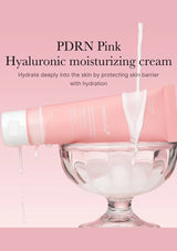 Pink hyaluronic moisturizing cream being poured into a glass bowl with pink background and text.