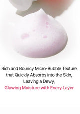 A close-up of pale pink micro-bubble foam with text below reading 'Rich and Bouncy Micro-Bubble Texture that Quickly Absorbs into the Skin, Leaving a Dewy, Glowing Moisture with Every Layer' on a white background.