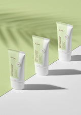 Four tubes of Unik skincare product on a light green and white background