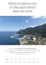 Scenic view of a coastal area with mountains and clear blue sky, promoting moisture balance care from Ulleungdo Island's deep sea water.