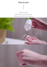 Hand using a white bottle to apply a product onto a cotton pad, with text on how to use it.