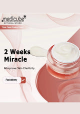 Cosmetic jar with cream on a light pink background, featuring Medicube branding.