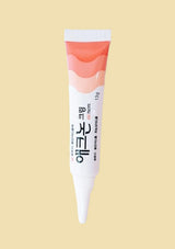 Tube of cream with a white cap on a beige background