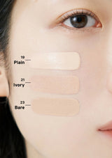 Three beige color swatches labeled 'Plain', 'Ivory', and 'Bare' on a person's face.