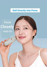 Woman using a skincare product on her face with a blue background