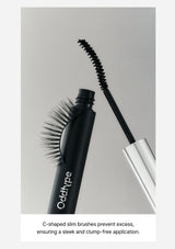Mascara with C-shaped slim brushes on a gray background
