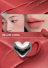 Lipstick with a heart-shaped cap on a white background, featuring color swatch and product name.