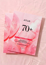 Anua 70+ Peach & Niacin mask packaging on a pink background