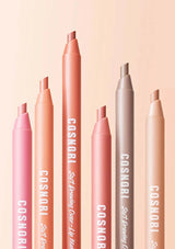 Set of Cosnori lip pencils on a peach background
