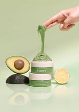 Flaner Avocado Butter Tart Face Cleanser with an avocado and lime on a light green background