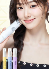 A woman holds a white handheld skincare device against her cheek, with three small cosmetic spray bottles shown along the bottom. The product branding appears to read 'MoeGlow' on the device and 'Product Co.