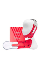 Red and white V-Care 3D facial massager with packaging on a white background