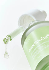 Medicube serum bottle with dropper on a white background