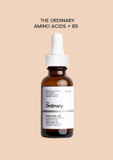 Bottle of 'The Ordinary' Amino Acids + B5 serum on a beige background
