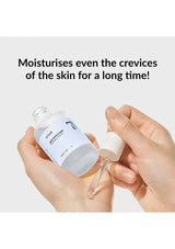 Hand holding a skincare product with text highlighting its moisturizing benefits.