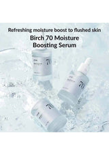 Birch 70 Moisture Boosting Serum with water droplets on a light blue background