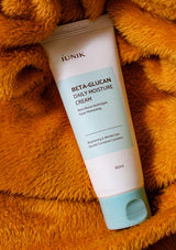 IUNIK Beta-Glucan Daily Moisture Cream packaging with product features and certifications on a white background.