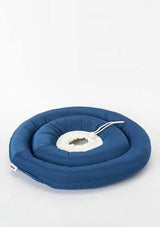 Blue inflatable pet bed with a white pump on a light gray background