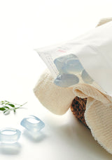 White towel with blue silicone rings on a white background