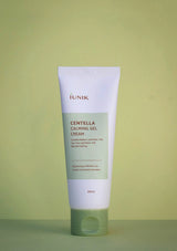 Tube of IUNIK Centella Calming Gel Cream on a green background