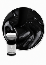 A small bottle of Hair Illusion 'The Maximum' hair filler shown in front of a circular close-up of thick, glossy black hair product.