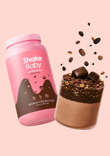 Pink 'Shake Baby' protein shake container with chocolate flavor on a pink background