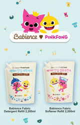 Babience Pinkfong detergent and softener refills with cartoon characters on a light blue background.