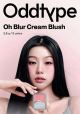 Model holding a blush compact with 'Oddtype Oh Blur Cream Blush' packaging on a pink background