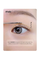 A close-up instructional panel showing an eye and eyebrow with a lash lifting tool touching the upper eyelash area. Text reads 'Aheb' and 'Move SLOWLY enough for the heat to fully reach the lashes, tracing a soft "C" shape as you glide along.