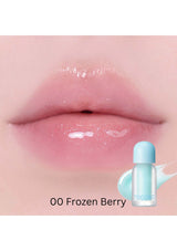 Lip gloss application on lips with a bottle labeled '00 Frozen Berry' on a pink background