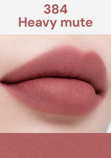 Lip color swatch labeled '384 Heavy Mute' on a white background