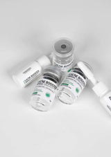 Acne booster product bottles on a white background