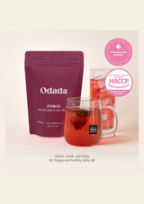 Odada tea package with a glass of tea on a light pink background