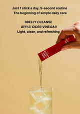 Hand pouring a red apple cider vinegar packet into a glass on a beige background with text about the product.